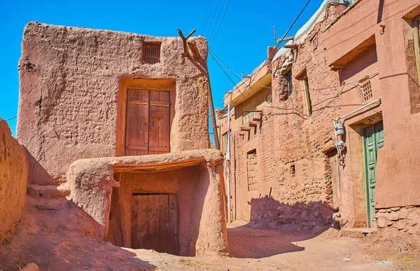 The medieval houses in Abyaneh mountain village are built of the earthen bricks and covered with red adobe, Iran.