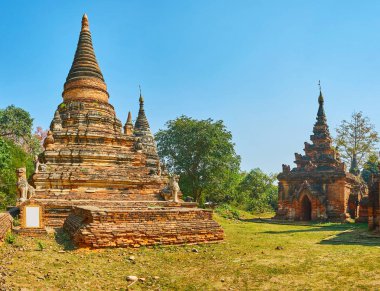 Daw Gyan Pagoda, antik Birmanya'nın başkentinde Ava (Inwa), Myanmar bulunan korunmuş tuğla türbelerin boyunca yürümek.