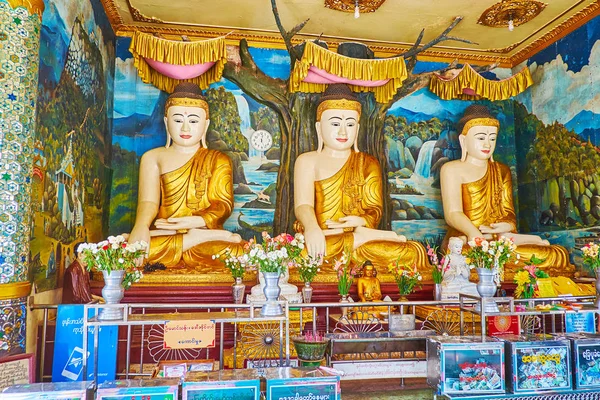 Bago, Myanmar - 15 Şubat 2018: Shwemawdaw selami IOmuz heykelleri Lord Buddha Touching Earth ve 15 Şubat Bago arka plan üzerinde renkli resimler resim evi doğal altar.