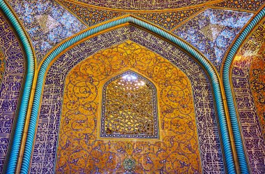 ISFAHAN, IRAN - OCTOBER 21, 2017: The carved Persian screen on wall of Sheikh Lotfollah mosque provides the light to its scenic prayer hall, on October 21 in Isfahan. clipart