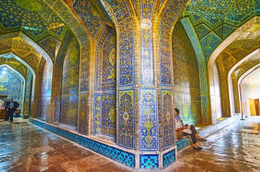 ISFAHAN, IRAN - OCTOBER 21, 2017: The L-shaped vestibule of Sheikh Lotfollah mosque with nice brickwork and ornate tile patterns, on October 21 in Isfahan. clipart