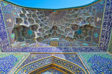 The muqarnas arch of the medieval portal of Sheikh Lotfollah Mosque, famous for its stunning tiling, Isfahan, Iran. clipart
