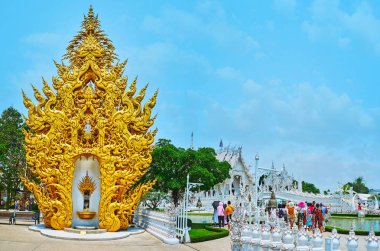The golden shrine in White Temple complex, Chiang Rai, Thailand  clipart