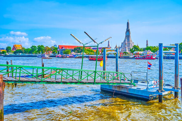 Wat Arun Behind The Chao Phraya River, Bangkok, Thailand 