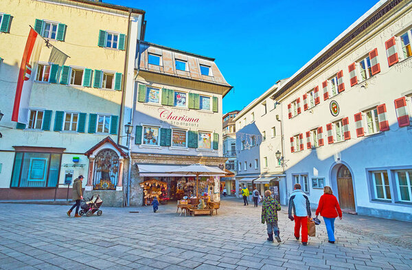 ZELL AM SEE, AUSTRIA - FEBRUARY 28, 2019: The Stadtplatz square has modest architecture, its traditional buildings are decorated with colorful shutters, on February 28 in Zell Am See