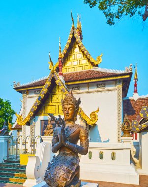 Devata sculpture at Sao Inthakin, Wat Chedi Luang, Chiang Mai, T clipart