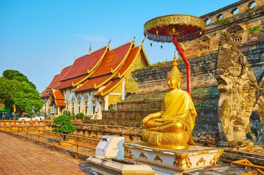 Gilt Buddha under chatra umbrella, Wat Chedi Luang, Chiang Mai,  clipart