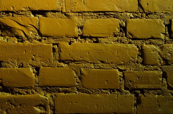 Bir tuğla duvar (yakın çekim, arka plan, doku yeşil boyalı).