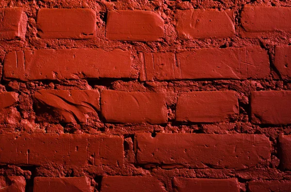 Bir tuğla duvar (yakın çekim, arka plan, doku kırmızıyla boyalı).