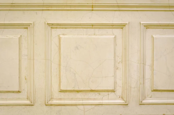 Vintage wall. Decorative Wall Moulding. Cracked marble background.