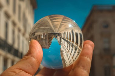 Reflection in a glass ball, downtown Lisbon clipart