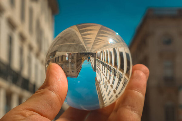 Reflection in a glass ball, downtown Lisbon