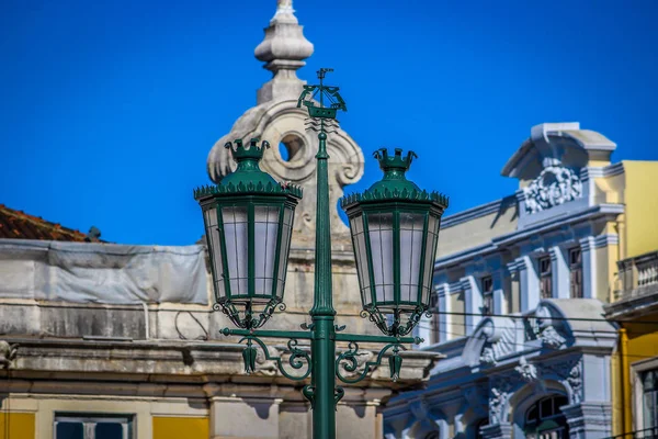 Vintage street lamps on the Commerce square, in Lisbon, Portugal
