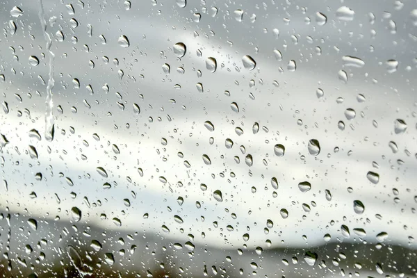Raindrops on a window - autumn weather forecast — Stock Photo, Image