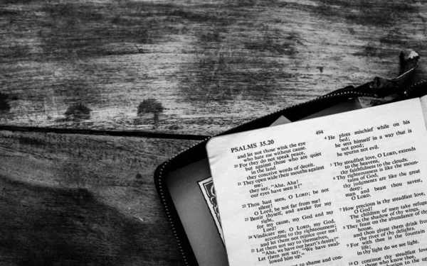 Holy Bible isolated on old vintage wooden table — Stock Photo, Image