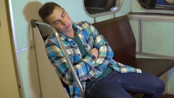 A young man fell asleep in a subway train. Old subway car — Stock Video