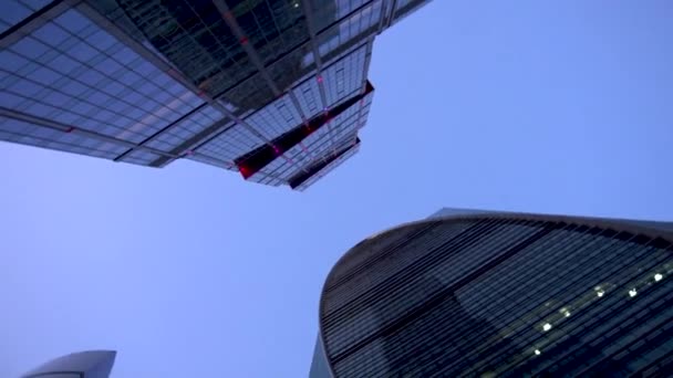 Two newly built skyscrapers. Skyscrapers are in Moscow city. View from below. Spin — Stock Video