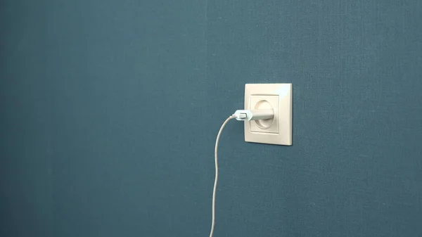 Charger mobile device is inserted into the socket — Stock Photo, Image