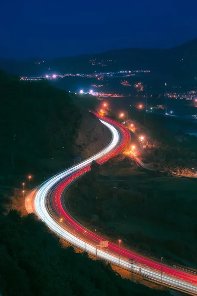 Car light trails in highway at night — Stock Photo, Image