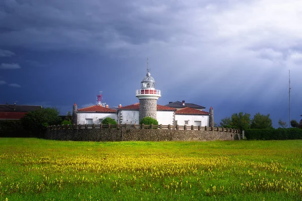 Getxo lighthouse in La Galea with beautiful stormy light — Stock Photo, Image