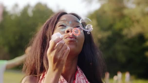 Black Woman Blowing Soap Bubbles Summer Party — Stock Video