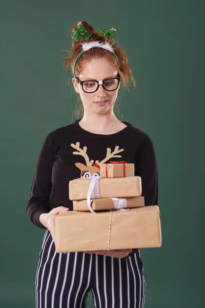 Displeased Woman Holding Stack Christmas Present — Stock Photo, Image