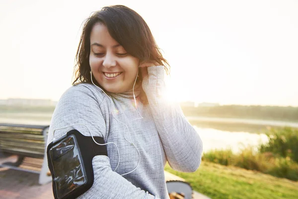 Happy Woman Choosing Best Song Running — Stock Photo, Image