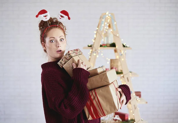 Shocked Girl Holding Stack Christmas Present — Stock Photo, Image