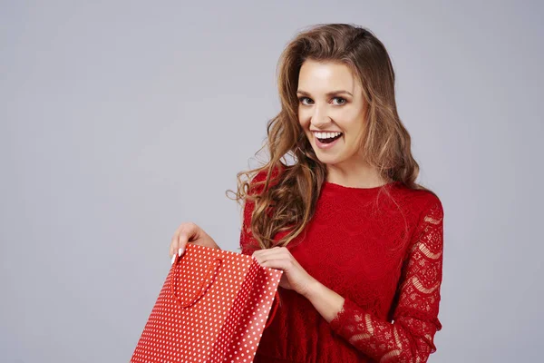 Surprised Woman Opening Gift Studio Shot Stock Picture