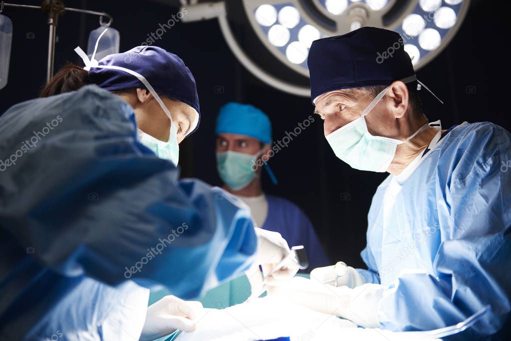 A very important operation in the dark surgical room