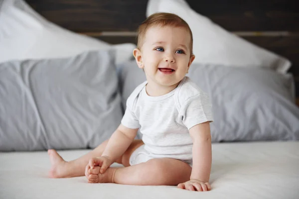 Smiling Baby Sitting Bed — Stock Photo, Image