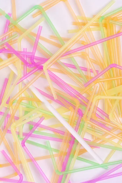 Bamboos straw among plastic drinking straws
