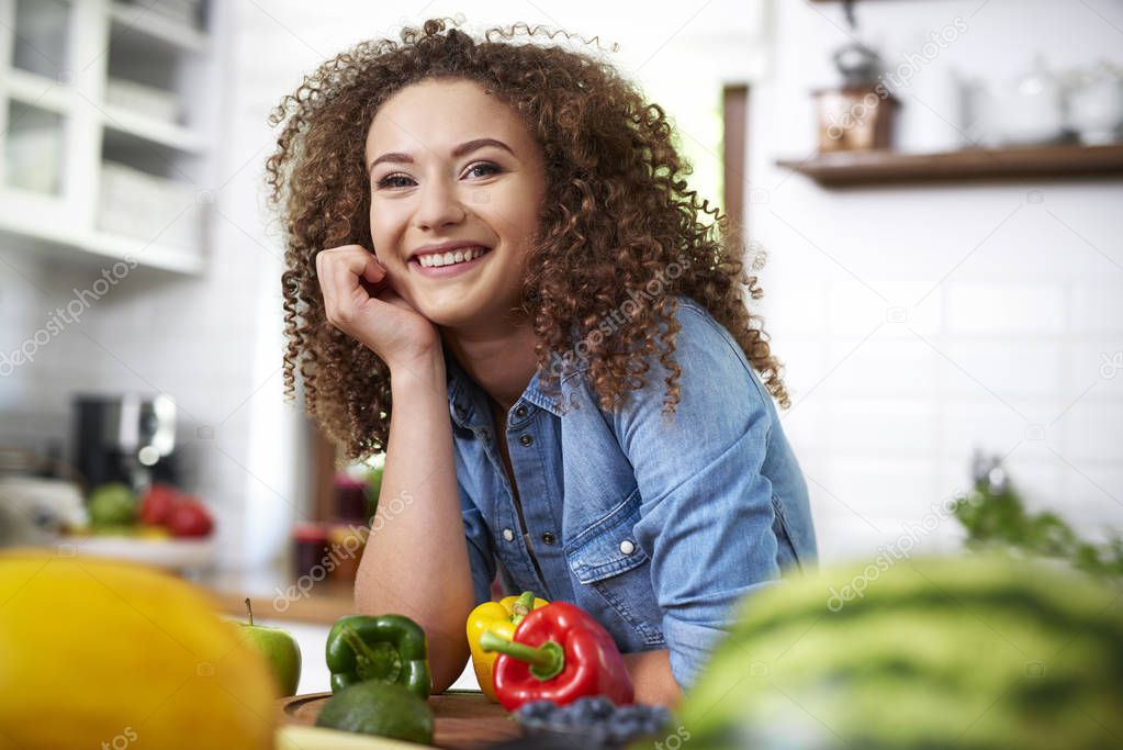 Portrait of young woman in domestic kitchen