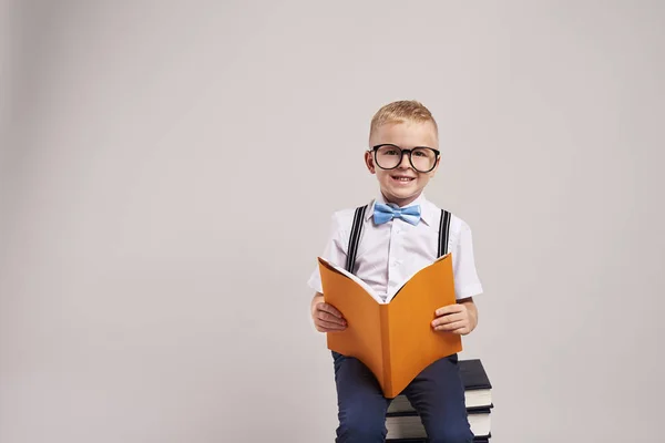 Smiling Schoolboy Reading Book — Stock Photo, Image