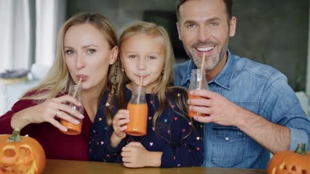 Cheerful Family Drinking Pumpkin Smoothie — Stock Video