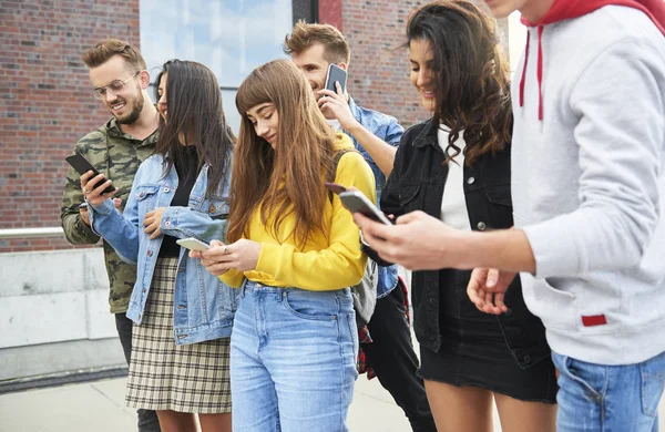 Young People Mobile Phones Standing Row — Stock Photo, Image