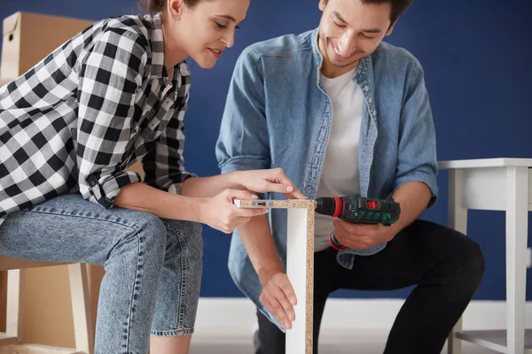 Couple Using Electric Drill Install Furnitures — Stock Photo, Image