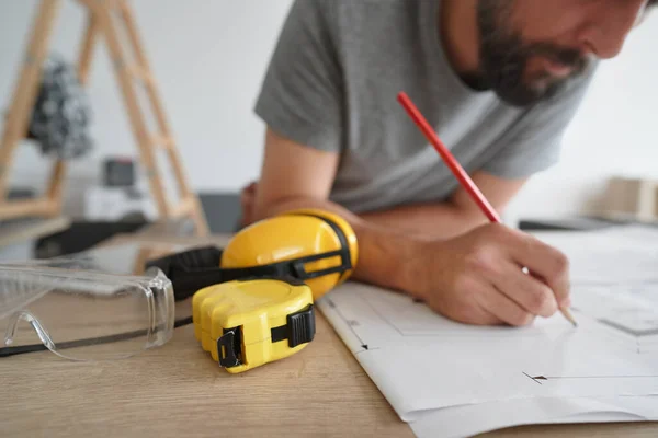 Carpenter Making Corrections Plans — Stock Photo, Image