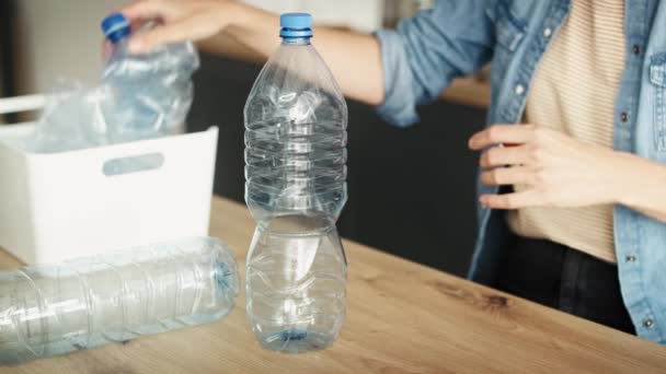 Video Woman Crushing Plastic Bottles Shot Red Helium Camera — Stock Video