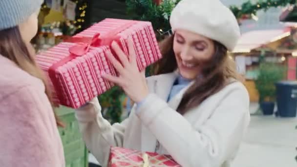 Handheld View Friends Exchanging Christmas Presents Shot Red Helium Camera — Stock Video