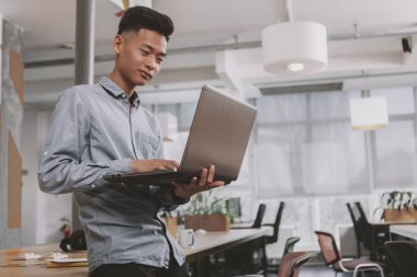 Young Asian businessman working at the office