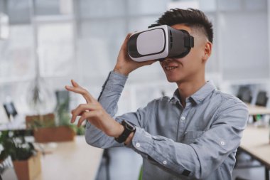 Young Asian businessman working at the office