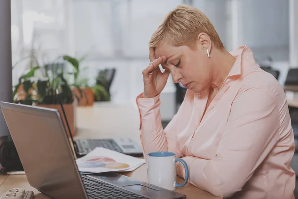 Mature businesswoman working at the office