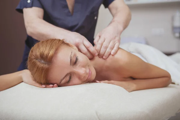 Gorgeous woman enjoying full body massage at spa center — стоковое фото