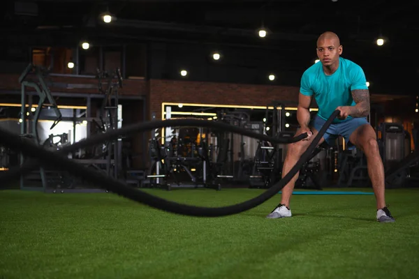 Handsome male African athlete working out at the gym — Stock Photo, Image