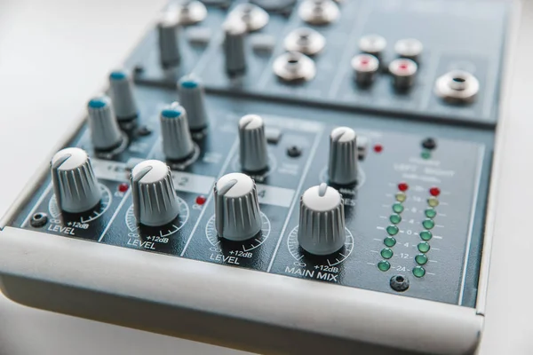 Photo of the analog audio mixer of the sound producer close up