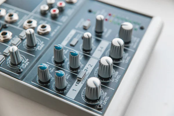 Photo of the analog audio mixer of the sound producer close up