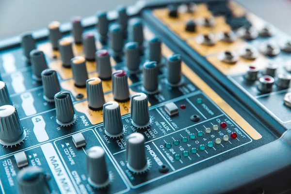 Photo of the analog audio mixer of the sound producer close up