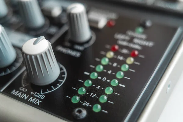 Photo of the analog audio mixer of the sound producer close up