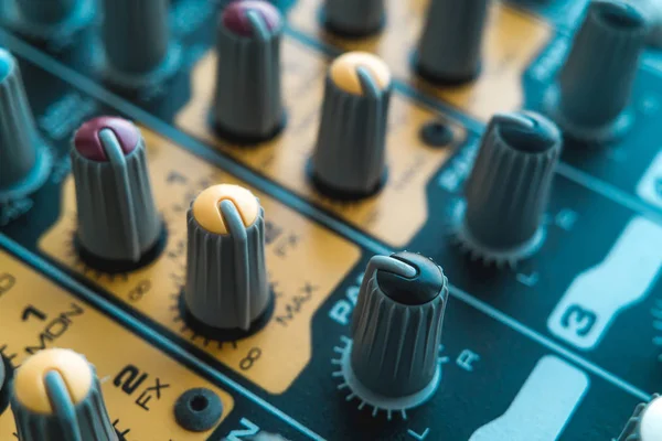 Photo of the analog audio mixer of the sound producer close up